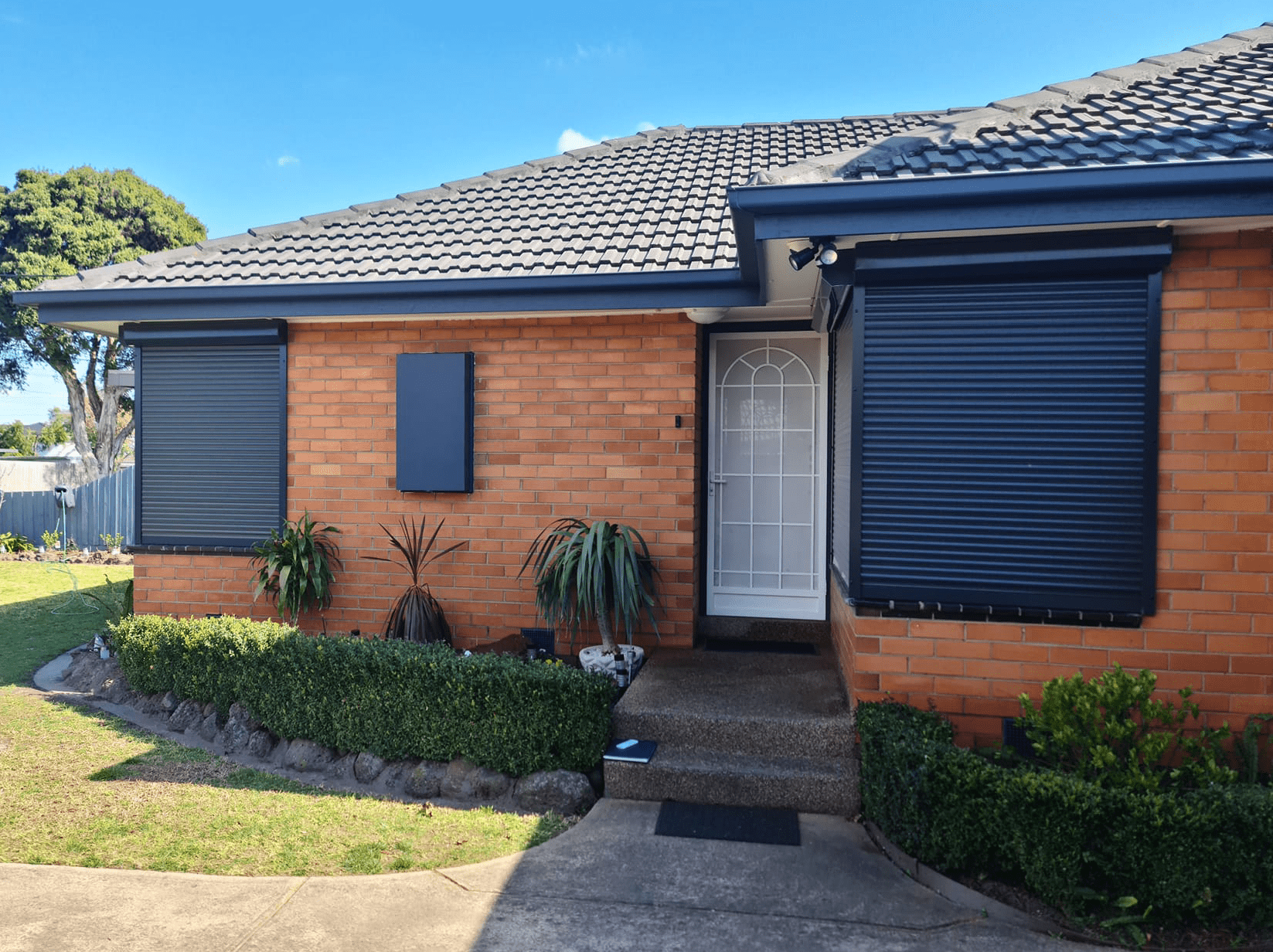 Front black shutters Front black roller shutters with main door