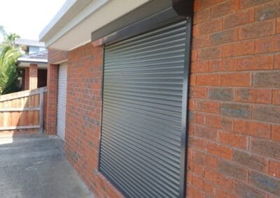 a brick building with a garage door