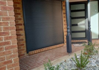 a brick building with a door and a window