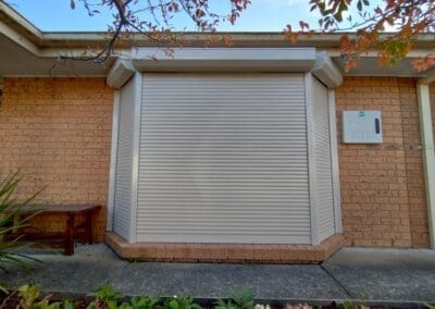 a building with a door and a box