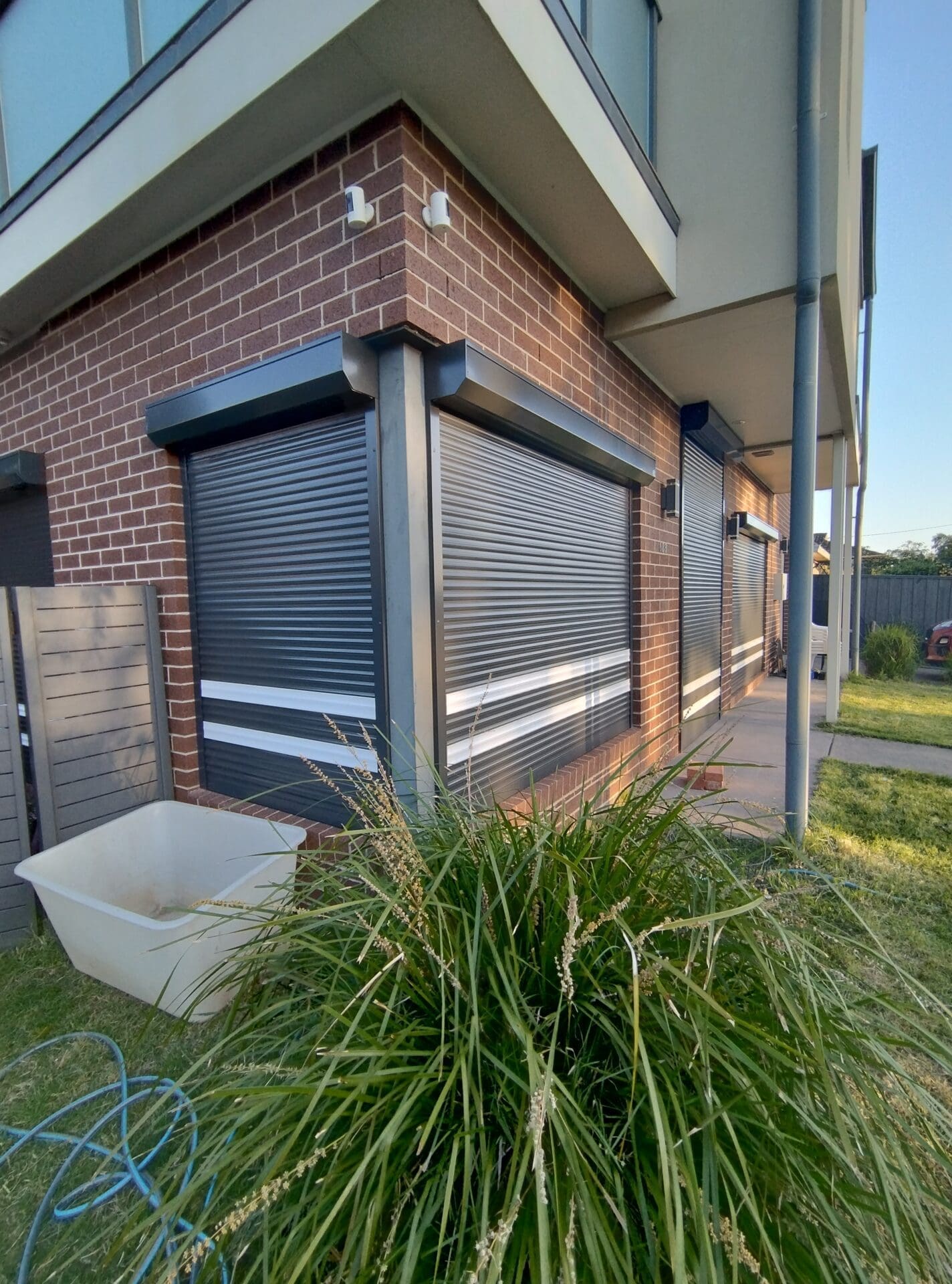 IMG_20231017_185554259_HDR Black shutters with white stripe front of the house
